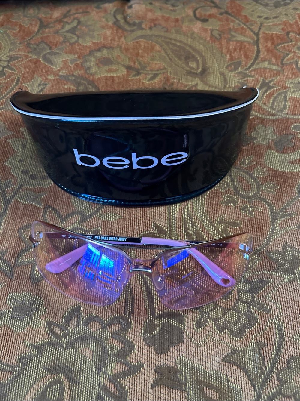 Juicy Couture Pink Rimless Sunglasses with Light Pink Temples includes bebe case